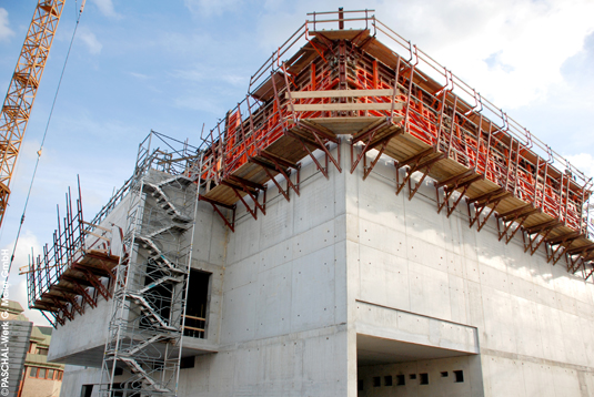 Athlete and Modular formwork at construction site