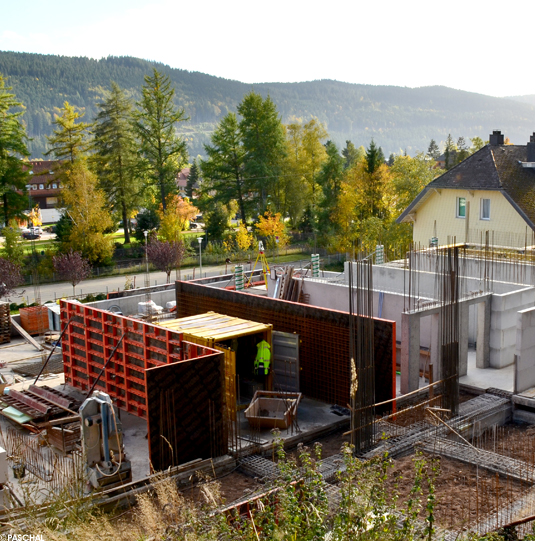 Steel reinforced concrete walls of the upper storeys